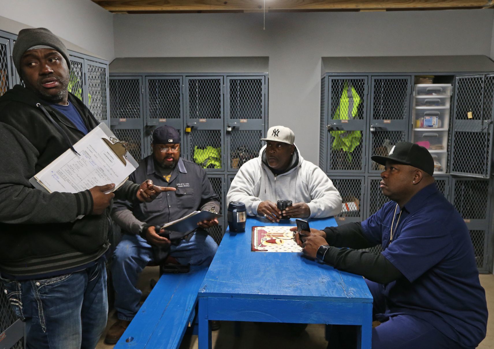 Foreman Tony Stokes hands out morning assignments